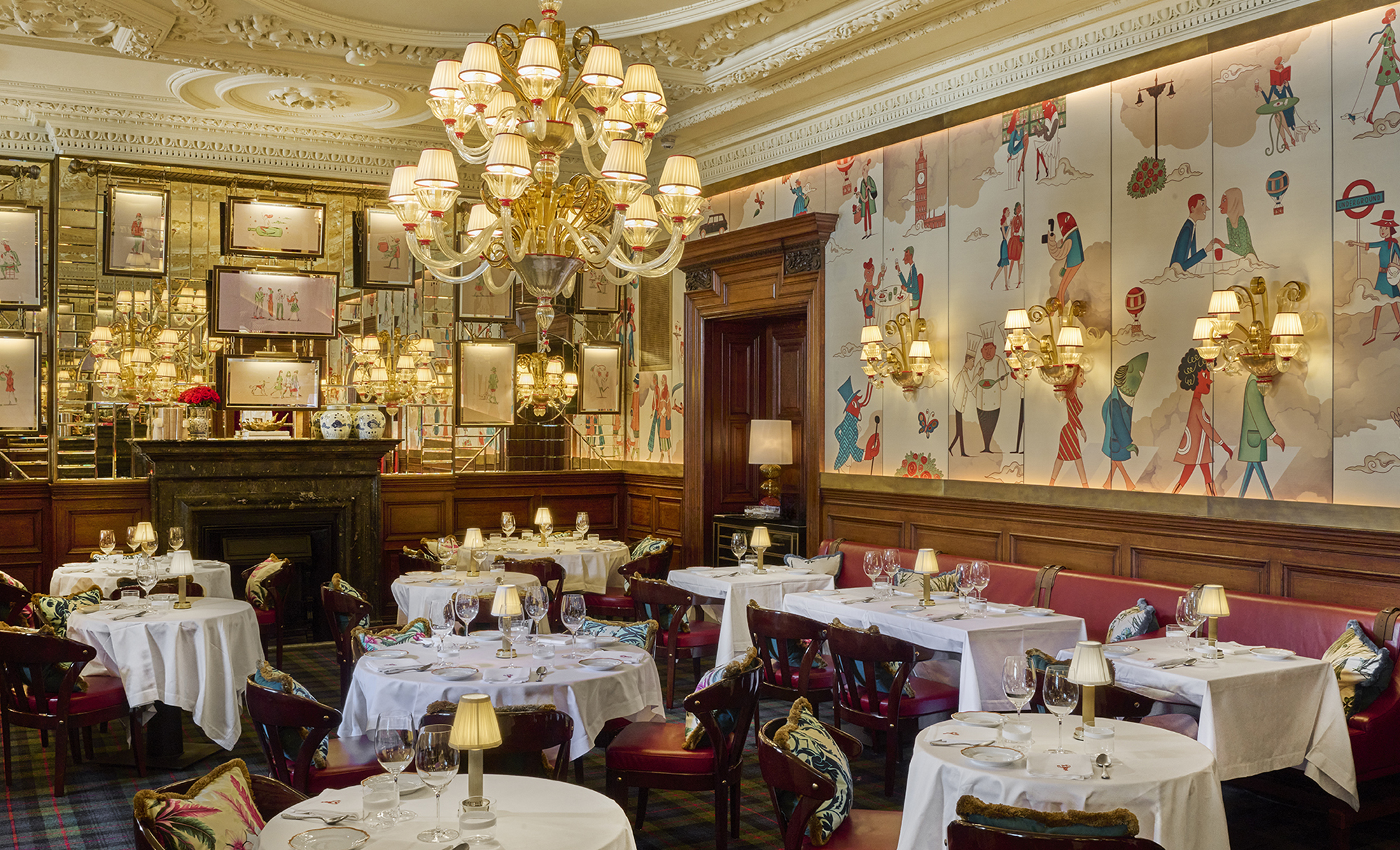Dining room at Langosteria London inside The OWO: custom architectural lighting by Luce5 set among historic furnishings and textured details.